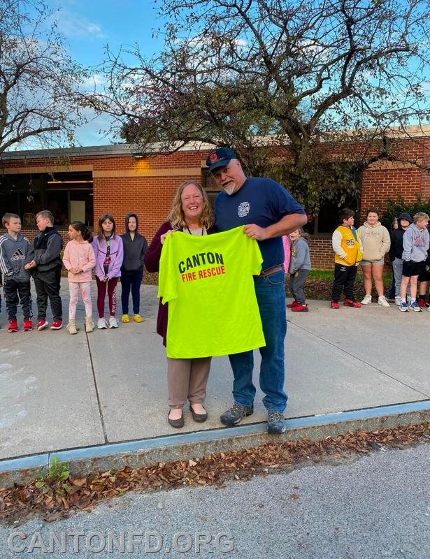 Retiring teacher Mrs. Massia becomes an honorary Firefighter